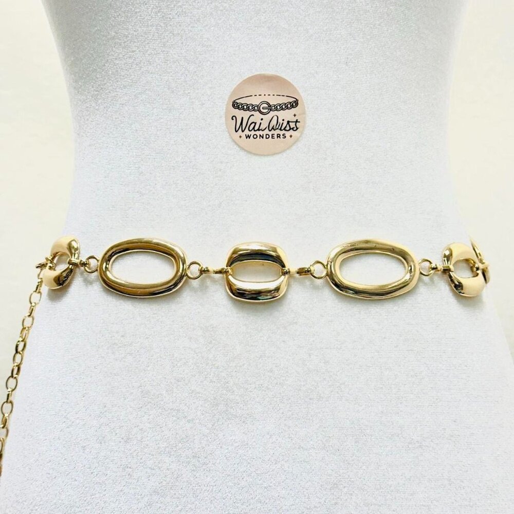 Gold tone oval belt buckle with gold tone chain and lobster clasp